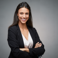 young professional woman smiling and standing with her arms crossed, professional headshot photography, professional headshot photographer, portrait photographer, portrait photography; photography in Fort Carson