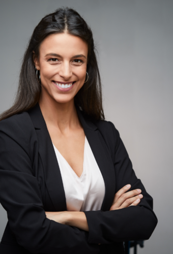 young professional woman smiling and standing with her arms crossed, professional headshot photography, professional headshot photographer, portrait photographer, portrait photography; photography in Fort Carson