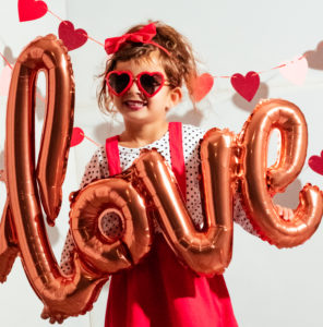 creative photo of girl holding love balloon