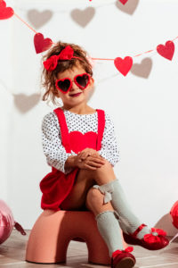 Child posing for creative valentine picture
