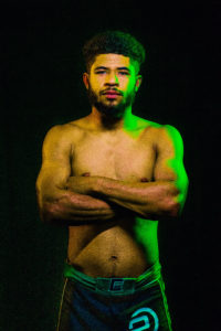 shirtless men black background, studio photography